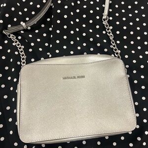 Brand new, never used, silver, Michael Kors cross body. Open to other offers :)